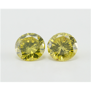 A Pair of Round Cut Loose Diamonds (0.9 Ct, Fancy Yellow (Color Irradiated) Color, I1-I2 Clarity)