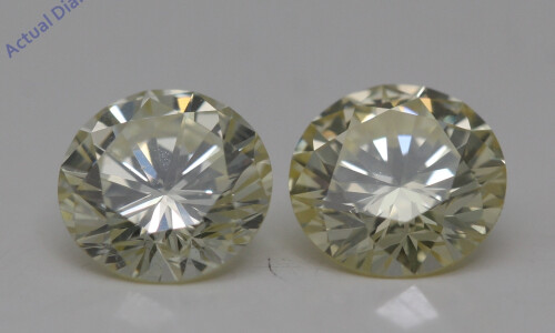 A Pair Of Round Cut Loose Diamonds (1.49 Ct,Yellow(Irradiated) Color,Si1 Clarity)